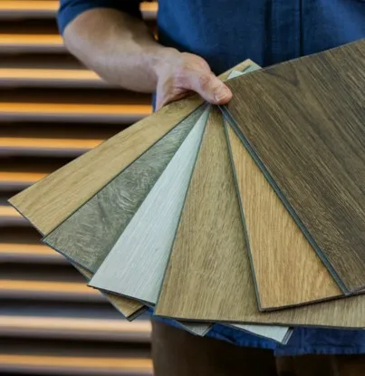 man-holding-flooring Samples | AJ Rose Carpets & Flooring
