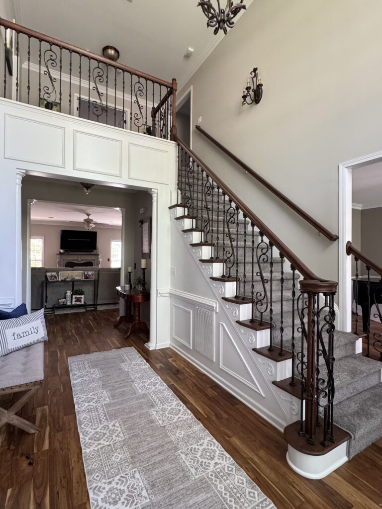 Gray Stair runner rugs leading to the second floor in a home by AJ Rose in Needham, MA - Lynnfield, MA - Natick, MA - Burlington, MA.