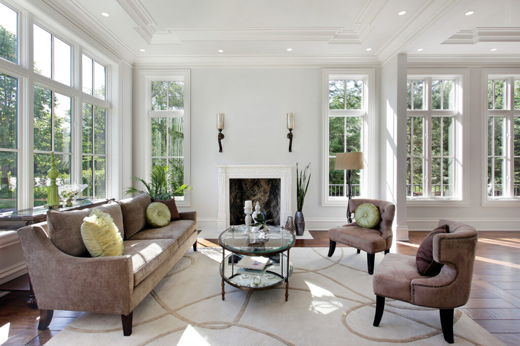 hardwood flooring in a historic home with fireplace and rug